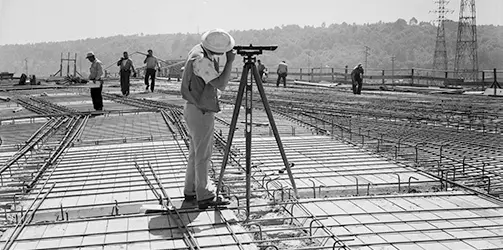 black and white construction surveyor tripod